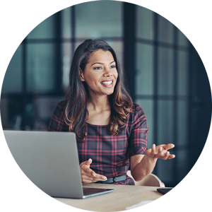 Woman talking in front of a laptop